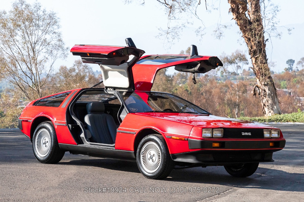 Red 1981 DeLorean DMC-12 with gullwing doors open