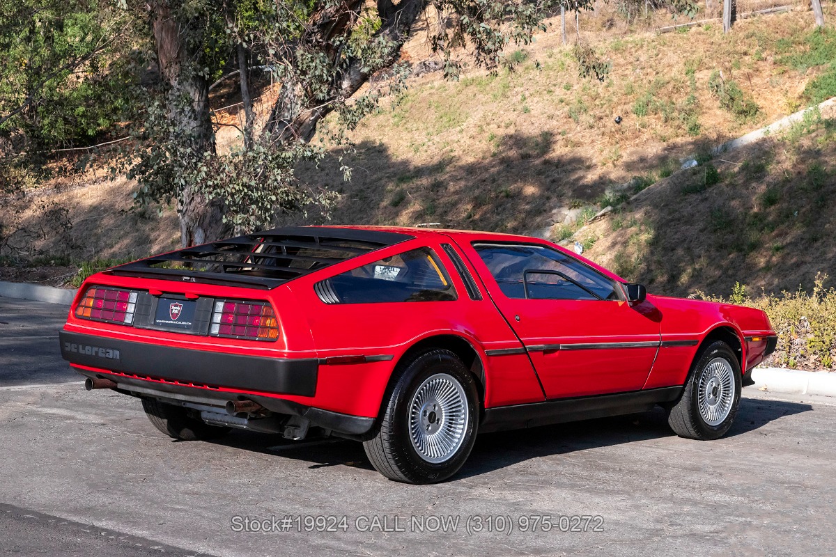 Red DeLorean DMC-12 rear three-quarter view